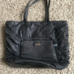 Travel tote by OGIO.  Black with floral pattern. Hold lap top & tons of pockets